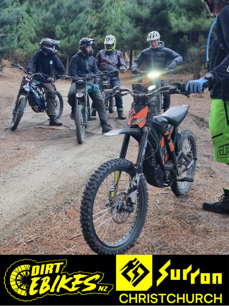 Group of electric surron dirt bike riders with their bikes on a trail, featuring Dirt E-Bikes NZ and Surron Christchurch logos.